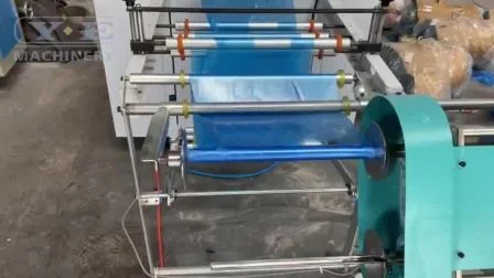 Máquina automática para fabricar delantales rodantes desechables de plástico PE CPE con cambiador de rollos